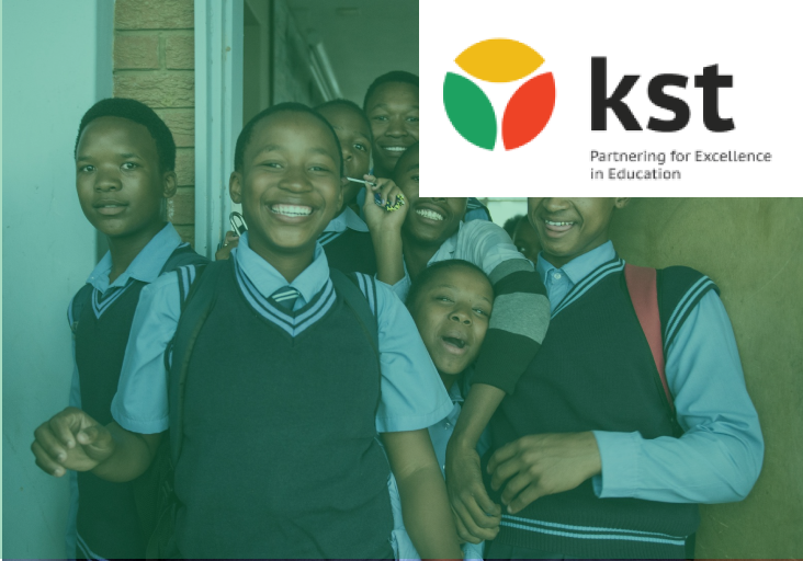 Group of students in school uniforms with KST logo
